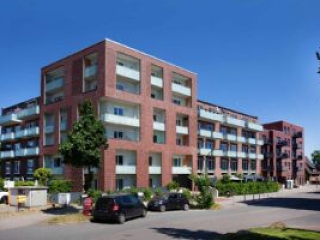 hausecke-ziegelfassade-andrea-kumm Hausecke mit Balkonen